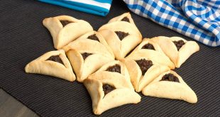 Triangular jewish pastries called Hamantaschen, some of the most popular Purim foods and drinks