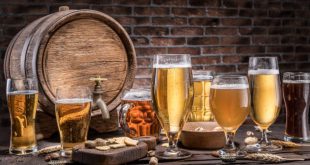 Glasses of craft beers and ale barrel, a collection from the best beer cities