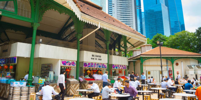 People eating at one of the most popular hawker centers in Singapore.