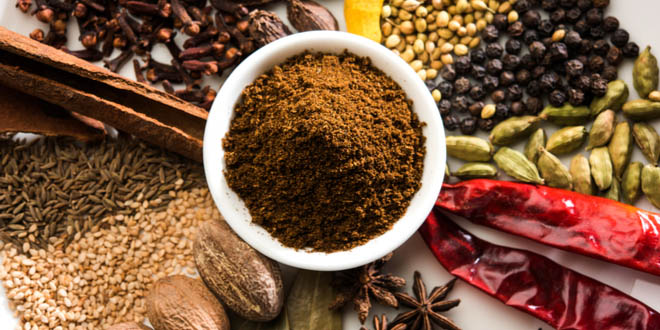 Garam masala powder and several colourful Indian spices.