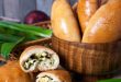 Homemade basket of Russian eats (pirogi) filled with eggs and green onion.