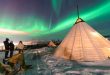 Traditional Sami tents (lappish yurts) in Norway offering tourists a comfortable place to watch the polar lights from after having a drink at an ice bar.