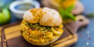 Burger of lampredotto tripe with herbs, a tasty Italian street food you should try when you eat and drink in Florence.